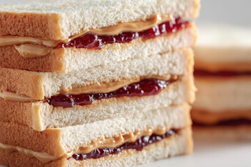 Stack of delicious peanut butter and jam sandwiches, classic comfort food
