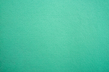 Turquoise felt fabric background.A photograph of the texture of mint-colored fabric.