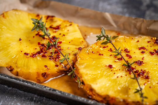Grilled pineapple slices with chili spice
