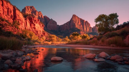 Sunset over red cliffs and winding river in a scenic park with warm golden light and vibrant pink sky illuminating the landscape