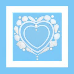 Heart shaped seashell pearl wreath on blue, white frame border. Romantic natural symbol of love,  Valentines, anniversary or birthday greeting card.