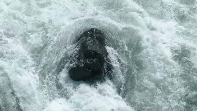 The turbulent waves are breathtaking, characterized by dynamic patterns and foam bubbles in rivers or oceans that truly showcase incredible energy and unparalleled beauty