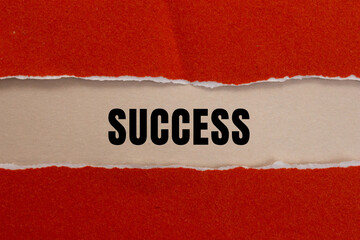 Success message written on ripped torn paper background. Conceptual Success symbol. Copy space.