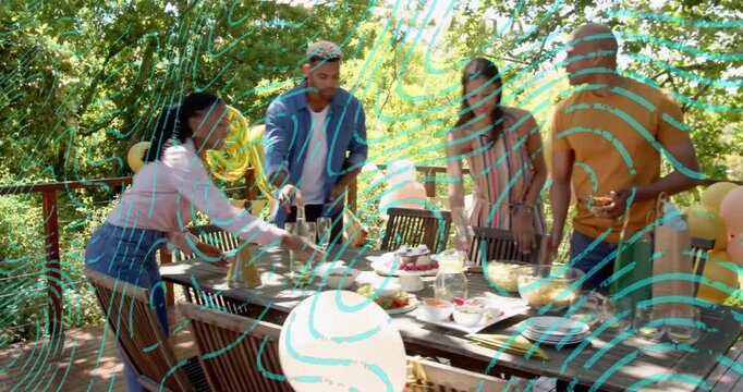 Group of four adults arranging table on deck preparing for celebration, animated tags guiding cake