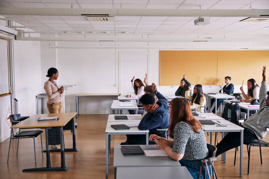 High angle view of Q and A segment going on in high school classroom
