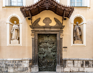Close-up of the 1996 bronze Slovene Door of St Nicholas Cathedral, with bas reliefs of Slovenian history and Pope John Paul II portrait, Ljubljana, Slovenia.