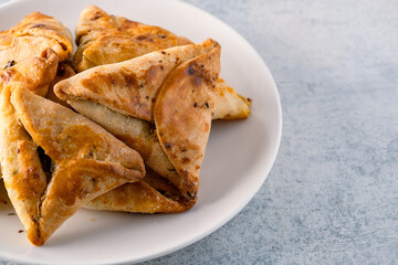 Homemade triangular pastry with spinach and cheese. A traditional Middle Eastern dish.