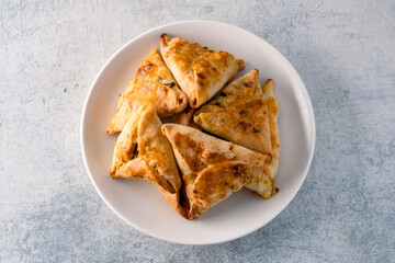 Homemade triangular pastry with spinach and cheese. A traditional Middle Eastern dish.