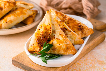 Homemade triangular pastry with spinach and cheese. A traditional Middle Eastern dish.