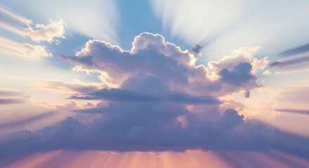 Dramatic clouds with sun rays shining through the gaps in the sky at sunset creating a beautiful scene