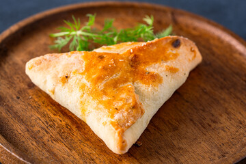 Homemade triangular pastry with spinach and cheese. A traditional Middle Eastern dish.