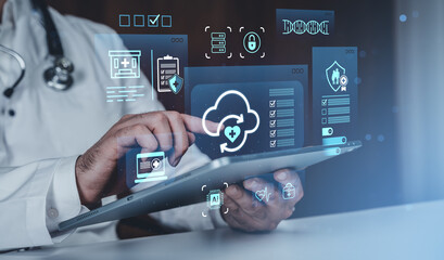 Doctor using digital tablet with futuristic icons representing electronic health record cloud...