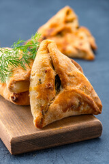 Homemade triangular pastry with spinach and cheese. A traditional Middle Eastern dish.