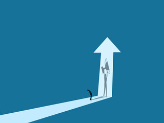 Businessman looks at the shadow of a person holding a trophy..