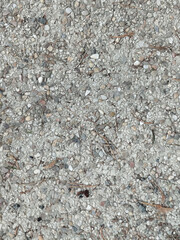 Textura de asfalto o hormigón con pequeños guijarros y gravilla fondo gris