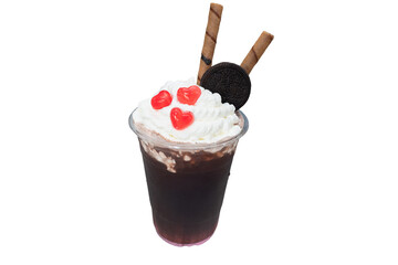A close-up shot of an attractive glass of iced coffee topped with cream, cookies, and heart-shaped candies. A delicious and satisfying treat