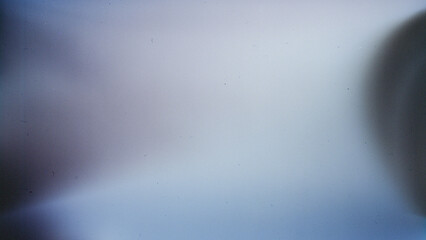 Soft gradient background with grainy light leak texture, featuring subtle blue and purple tones,...