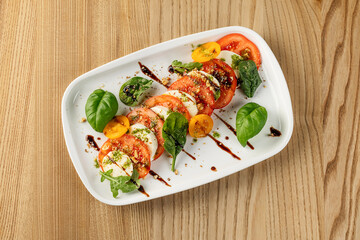 A Caprese salad, a classic Italian dish. Perfect for Italian cuisine, healthy eating, and Mediterranean food themes.