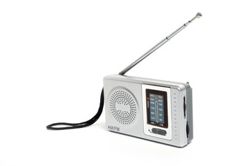 Portable battery-powered AM/FM radio photographed against a white background.