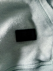 Close-Up Of Black Tag On Fabric