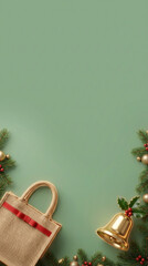 Christmas flatlay, festive golden bell, bauble, tote bag, green background