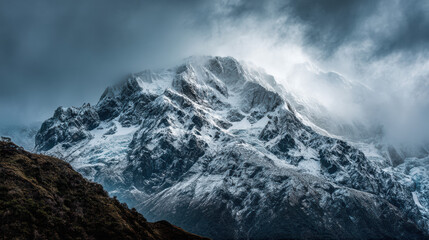 A majestic snow-capped mountain peak rises dramatically into a cloudy sky, creating a breathtaking and awe-inspi natural landscape in a remote setting.