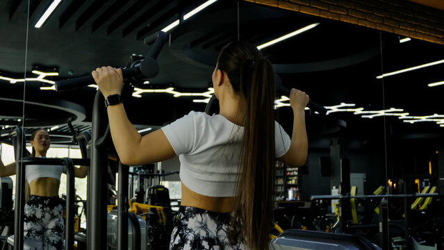 Woman performing a pull-up exercise