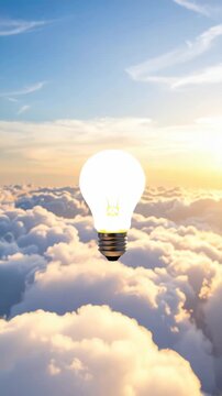 Conceptual image of an illuminated lightbulb floating above a sea of clouds, against a bright, sunlit sky background.
