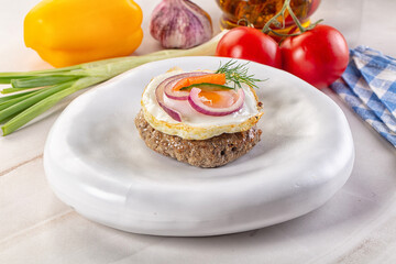 Beefsteak chop with roasted egg