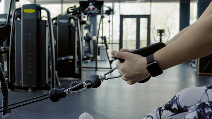 Person lifting a barbell in a gym