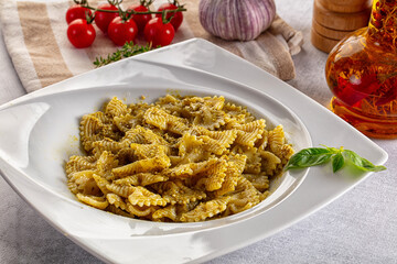 Italian green pasta farfalle with pesto