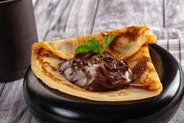 Sweet pancake with chocolate paste
