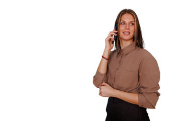 Young businesswoman smiling, talking on a smartphone, looking away, with copy space on a transparent background