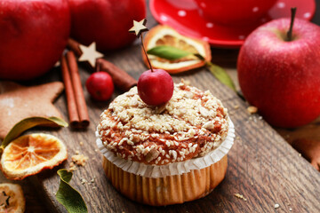 Christmas muffins with seeds on wooden table.