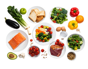 A variety of fresh vegetables, fruits, and protein sources arranged on plates and bowls for a healthy meal setup