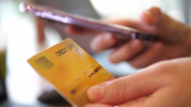 Hands Holding Credit Cards and Smartphone for Online Payment &ndash; Digital Banking, E-Commerce, Fintech 4K Footage