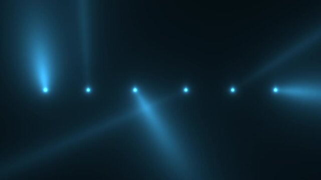 atmospheric haze and sweeping blue spotlights create energetic concert environment