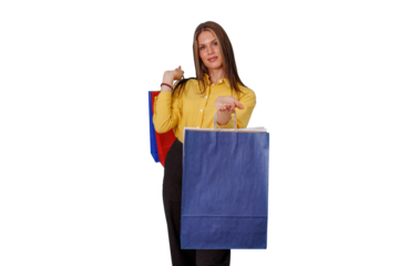 Woman presenting shopping bag, carrying colorful bags, depicting consumerism, retail, and sales on transparent background