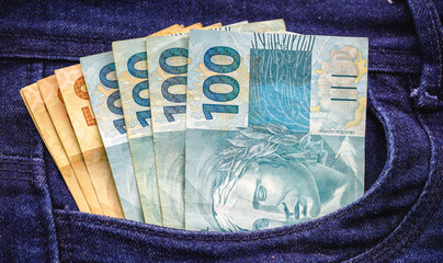 Brazilian money notes, in your pocket, end of year promotion, discount, savings