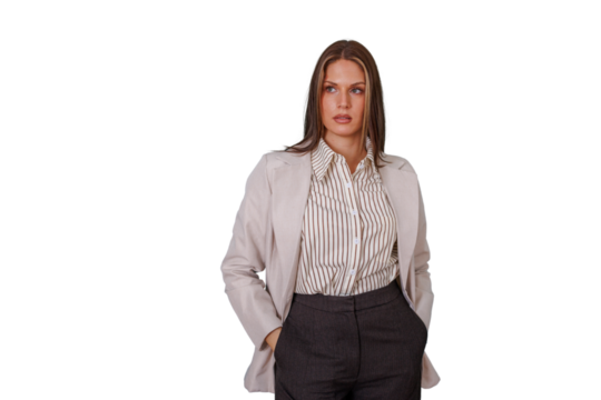 Confident young businesswoman posing with hands in pockets, looking to the side with pensive expression on transparent background
