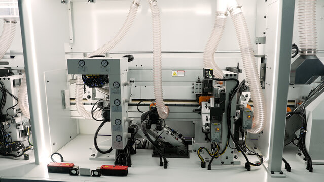 Industrial woodworking machine manufacturing furniture panels - Powered by Adobe