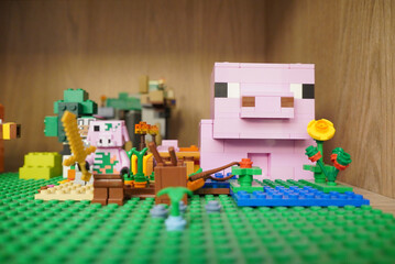 Naklejka premium Minecraft Lego scene featuring a pig, crops, and a golden sword