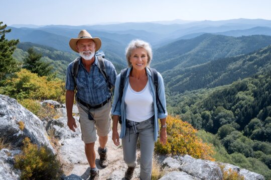Senior couple hiking mountains enjoying active healthy lifestyle - Powered by Adobe