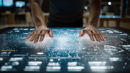 A person interacts with a high-tech touchscreen display, showcasing intricate data visualizations and glowing graphics in a modern environment.