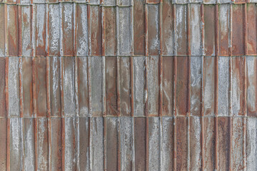 Abstract background of rusty corrugated metal texture close up
