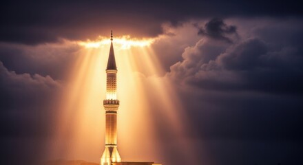 Dramatic mosque minaret at sunset with golden sun rays through clouds