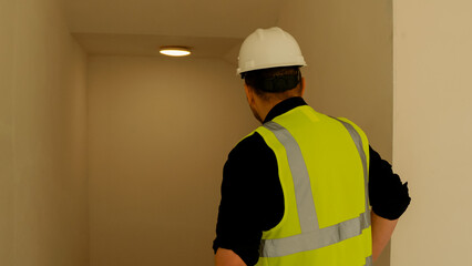 A construction foreman conducts an inspection at a construction site