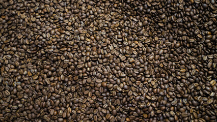 Full frame texture background of dark roasted coffee beans close-up