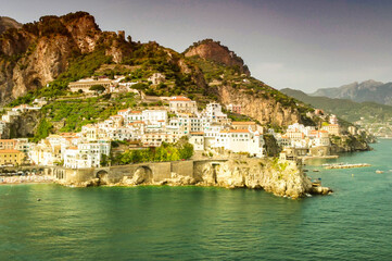 Fototapeta premium Panoramic aerial view of Amalfi coastline from a moving drone, Campania - Italy.