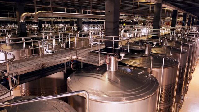 Huge metal fermentation tanks in modern wine factory Rioja Spain